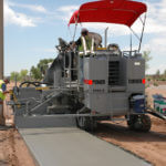 power curber machine creating curb and paving roads