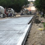 power curber machine creating curb and paving roads