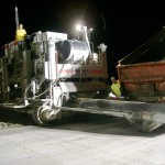 power curber machine creating curb and paving roads