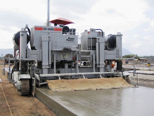 power curber machine creating curb and paving roads