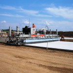 power curber machine creating curb and paving roads