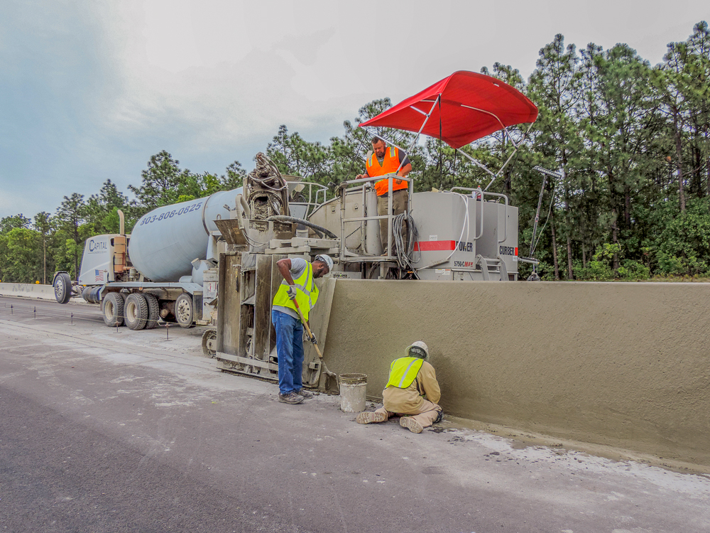 Construction team using 5700-C-MAX to build highway barriers