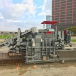 power curber machine creating curb and paving roads