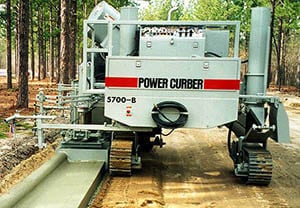 Power Curbers 5700-B curbing machine paving a sidewalk