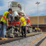 power curber machine creating curb and paving roads