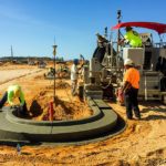 power curber machine creating curb and paving roads