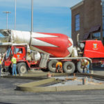 power curber machine creating curb and paving roads