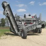 power curber machine creating curb and paving roads