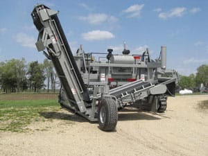 power curber machine creating curb and paving roads