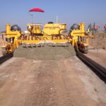 power curber machine creating curb and paving roads