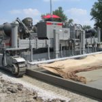 power curber machine creating curb and paving roads