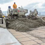 power curber machine creating curb and paving roads