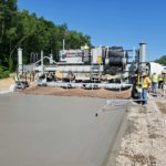 power curber machine creating curb and paving roads