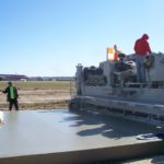 power curber machine creating curb and paving roads