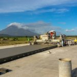 power curber machine creating curb and paving roads