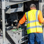 power curber machine creating curb and paving roads