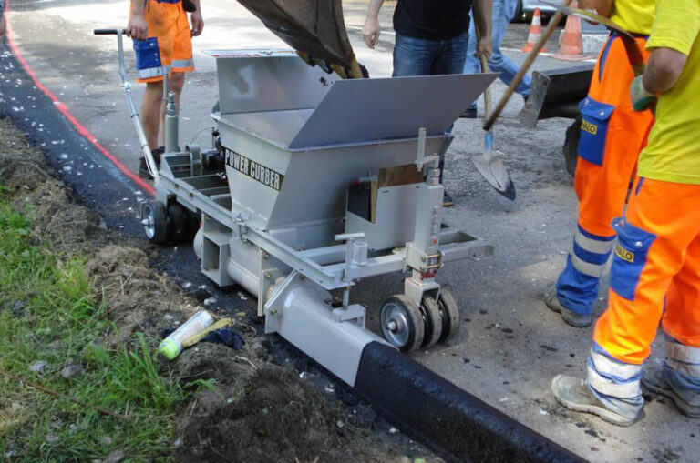 150 asphalt extruder making curb