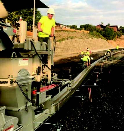 Knox Concrete slipforming roll curb on a ramp with their 5700-B