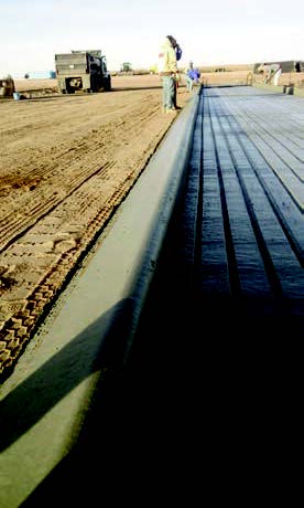 Slipform design produced by the Power Paver to help contain cattle waste