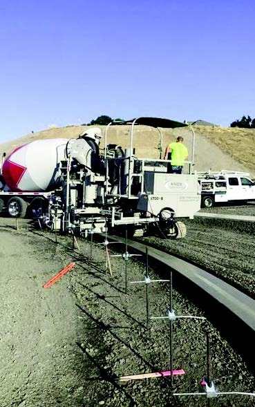 Knox Concrete working on roundabout with Power Curber 5700-B machine