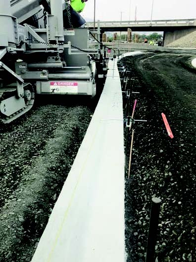 Knox concrete team slipforming with Power Curber 5700-B