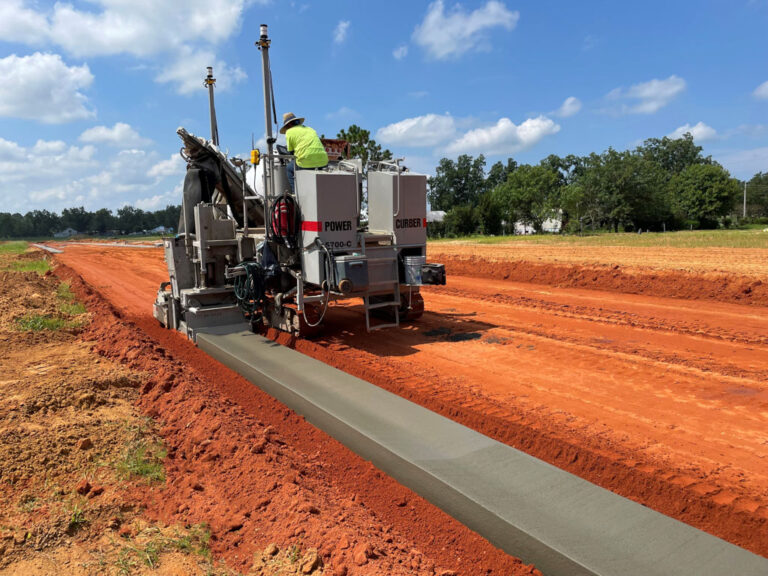 5700-C laying curb in an open field