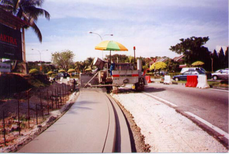 construction team laying sidewalk