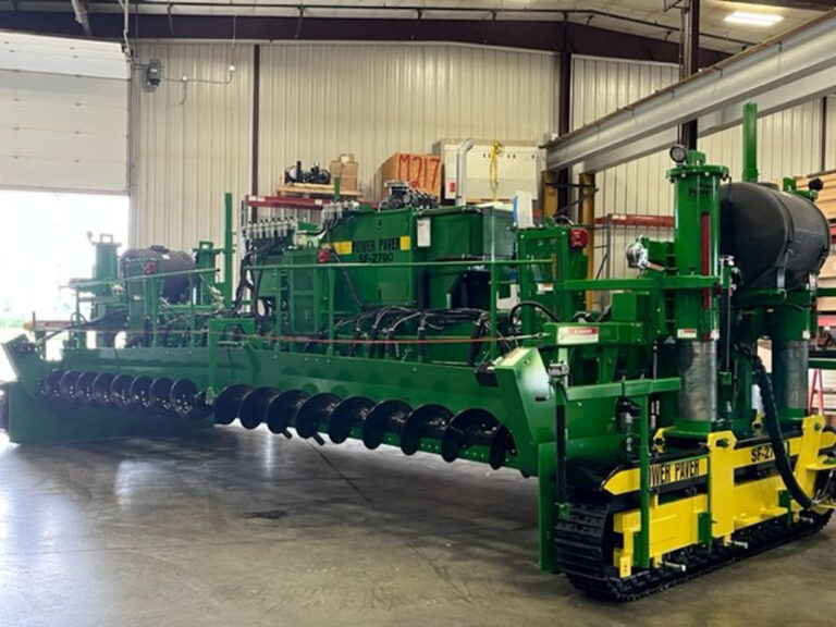 Green Power Paver SF-2700 machine on display inside a warehouse showroom.